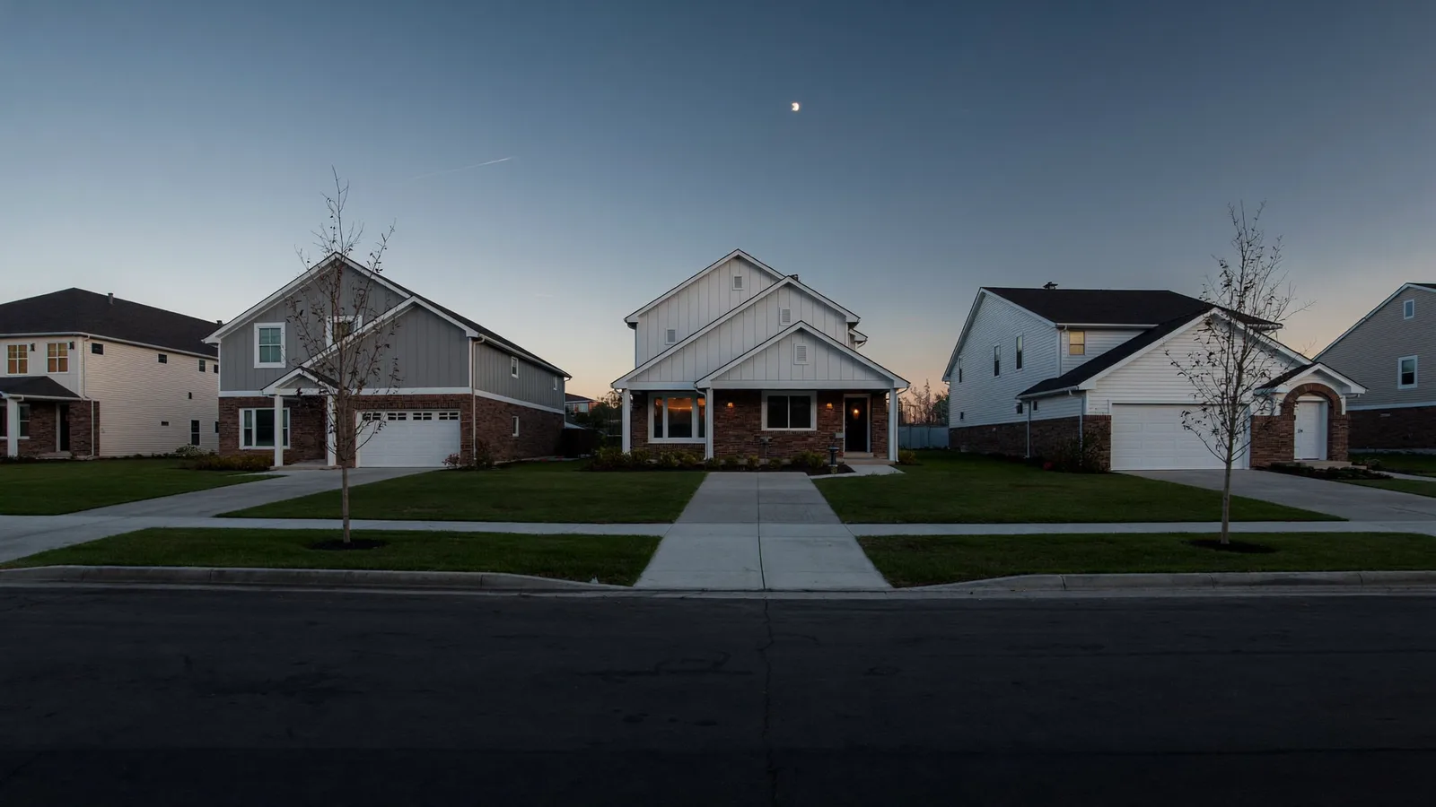 Ranch-style homes along a residential street with mature trees
