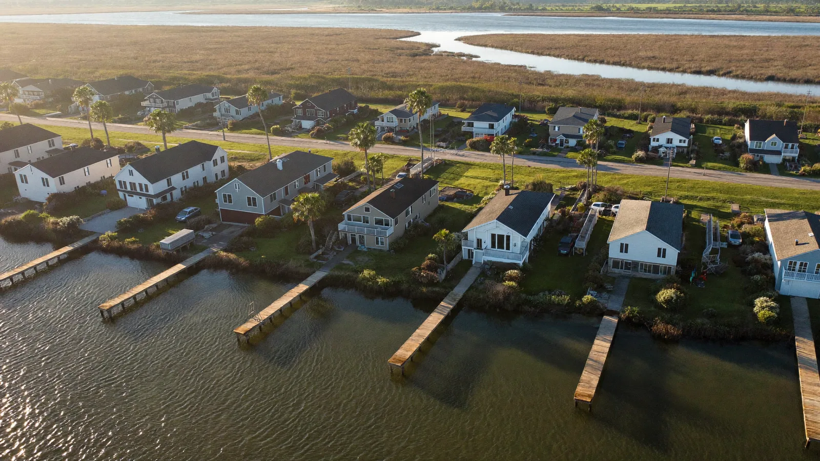 Waterfront homes with private docks along a tidal canal